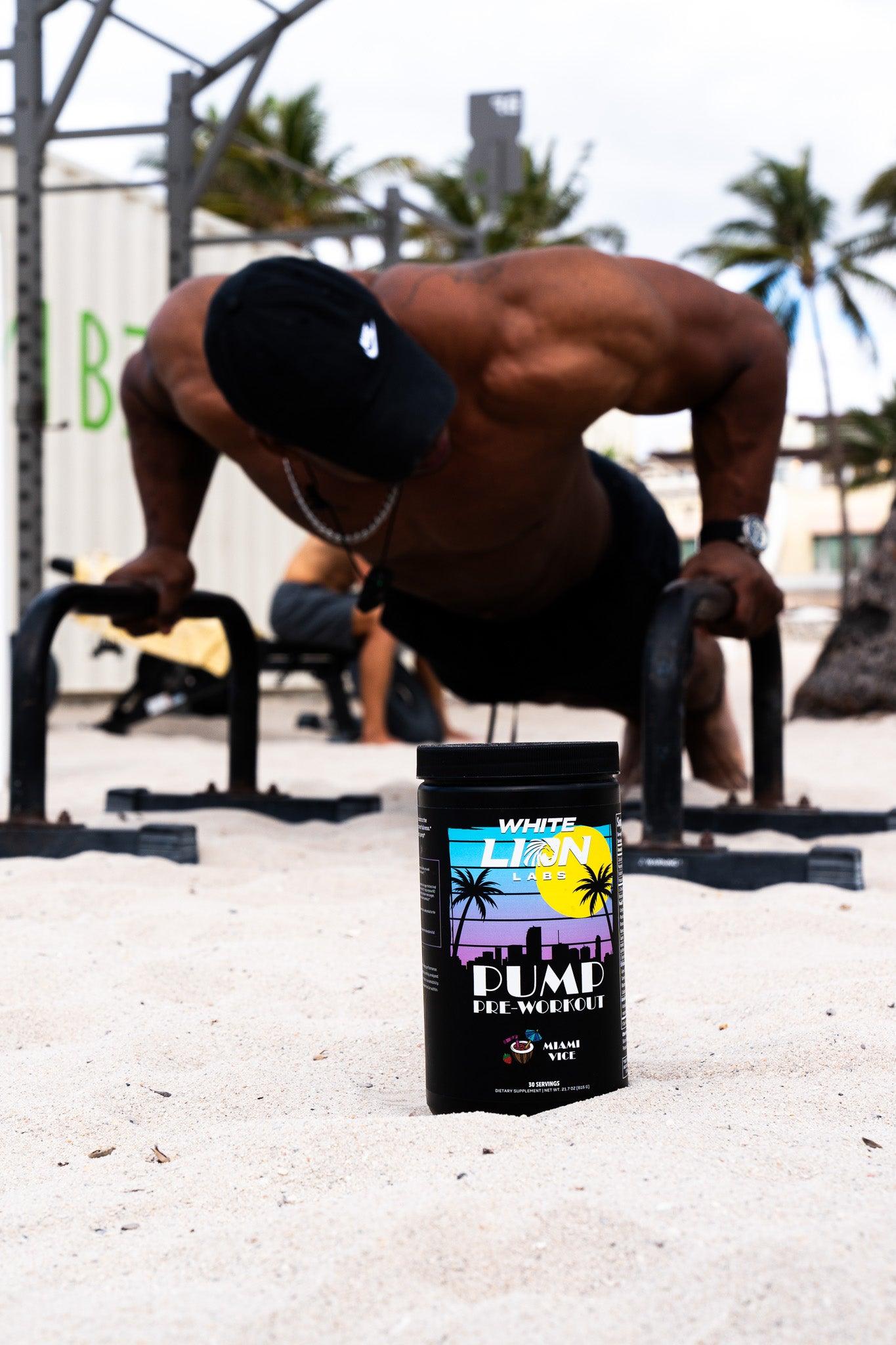 White Lion Labs Non-Stim Pump Pre-Workout jar in foreground with athlete doing push-ups on a beach gym