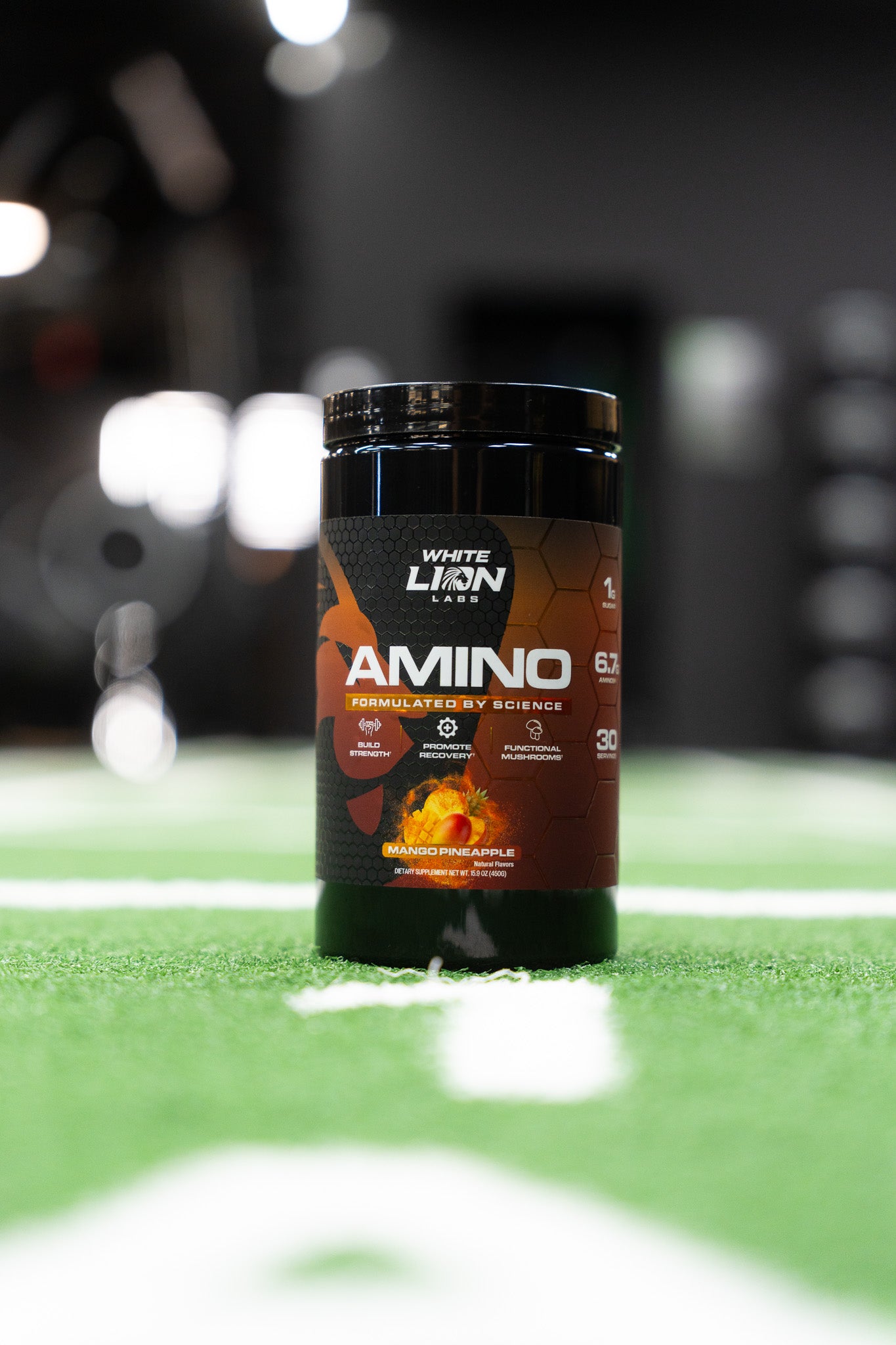 White Lion Labs Amino Premium EAA Blend container on a sports field